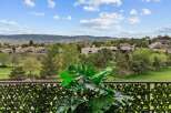 Enjoy breathtaking views from this property, overlooking a lush golf course and rolling hills.