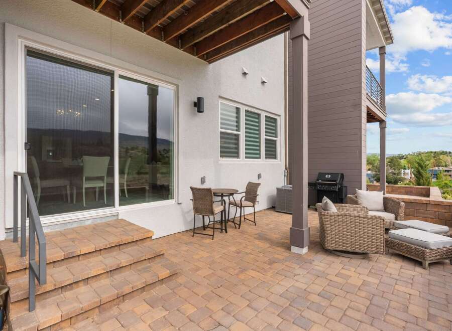 Enjoy outdoor living on this spacious patio, perfect for entertaining or relaxing.