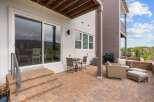 Enjoy outdoor living on this spacious patio, perfect for entertaining or relaxing.