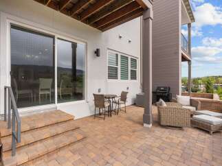 Enjoy outdoor living on this spacious patio, perfect for entertaining or relaxing.