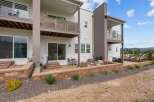 Experience modern living in this stunning multi-level townhouse featuring a private patio and balcony spaces perfect for outdoor entertaining.