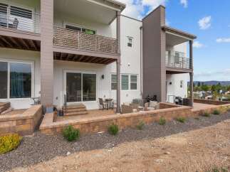 Experience modern living in this stunning multi-level townhouse featuring a private patio and balcony spaces perfect for outdoor entertaining.