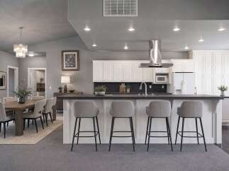 Experience modern living in this stunning open-concept kitchen and dining area.