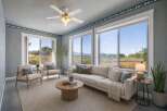 Experience breathtaking natural beauty from this living room, featuring expansive windows that showcase stunning landscape views.
