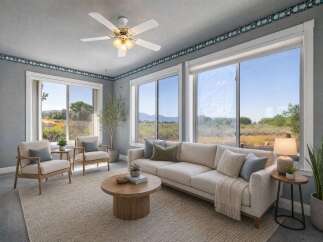 Experience breathtaking natural beauty from this living room, featuring expansive windows that showcase stunning landscape views.