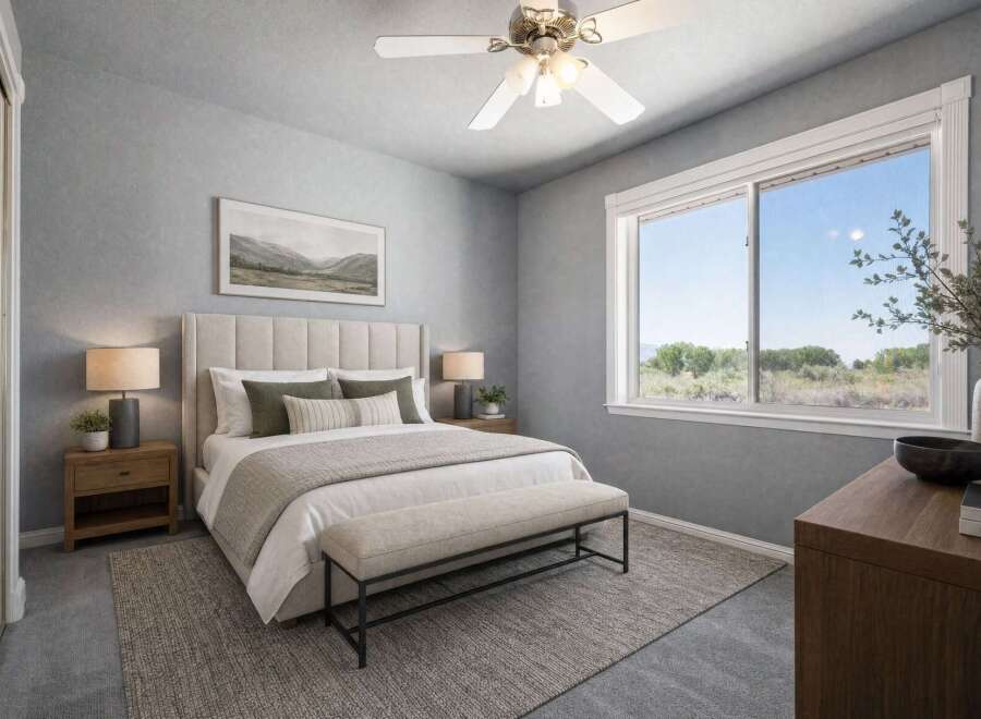 Experience serene living in this beautifully appointed bedroom, featuring a plush, upholstered headboard and a comfortable bench at the foot of the bed.