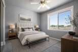 Experience serene living in this beautifully appointed bedroom, featuring a plush, upholstered headboard and a comfortable bench at the foot of the bed.
