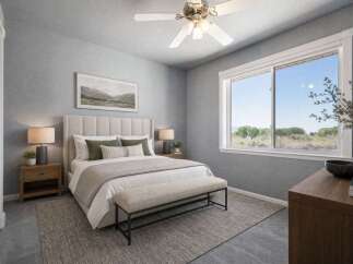 Experience serene living in this beautifully appointed bedroom, featuring a plush, upholstered headboard and a comfortable bench at the foot of the bed.