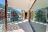 Experience modern living with this stunning balcony offering panoramic mountain views and sleek architectural design.