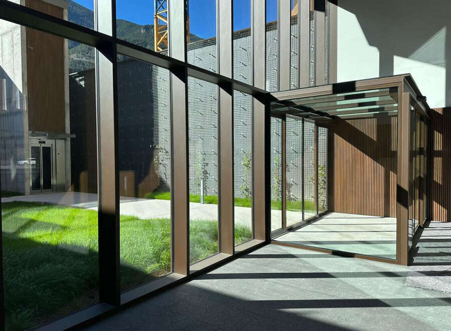 Experience modern living with this stunning property featuring expansive glass walls that invite natural light and offer picturesque views of the surrounding landscape.