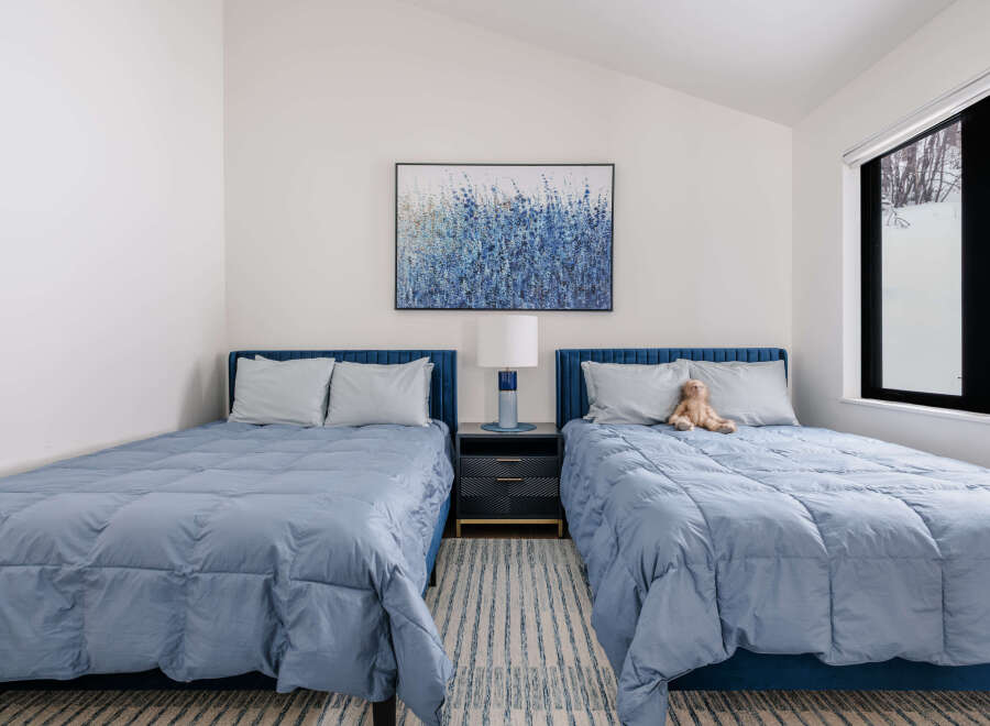 This charming bedroom features two comfortable twin beds, perfect for accommodating guests or family.