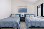 This charming bedroom features two comfortable twin beds, perfect for accommodating guests or family.