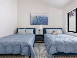 This charming bedroom features two comfortable twin beds, perfect for accommodating guests or family.