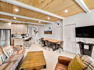 Experience modern living in this beautifully appointed space, featuring a sleek kitchen with stainless steel appliances and ample cabinetry.