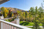 Experience the beauty of autumn from this stunning property, offering breathtaking views of colorful fall foliage and a picturesque mountain landscape.