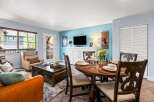 Experience comfortable living in this inviting space, featuring a cozy living area with plush seating and a stylish dining set perfect for meals.
