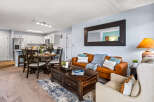 Experience modern living in this beautifully appointed apartment, featuring a spacious open-concept living and dining area perfect for entertaining.