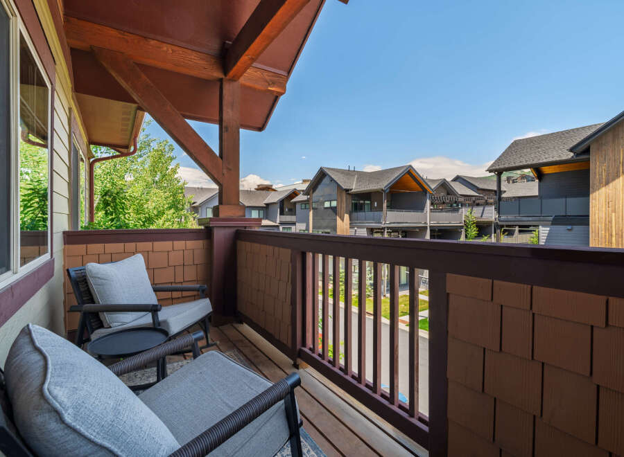 Enjoy your morning coffee or evening relaxation on this charming balcony, complete with comfortable seating and a small table.