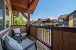 Enjoy your morning coffee or evening relaxation on this charming balcony, complete with comfortable seating and a small table.
