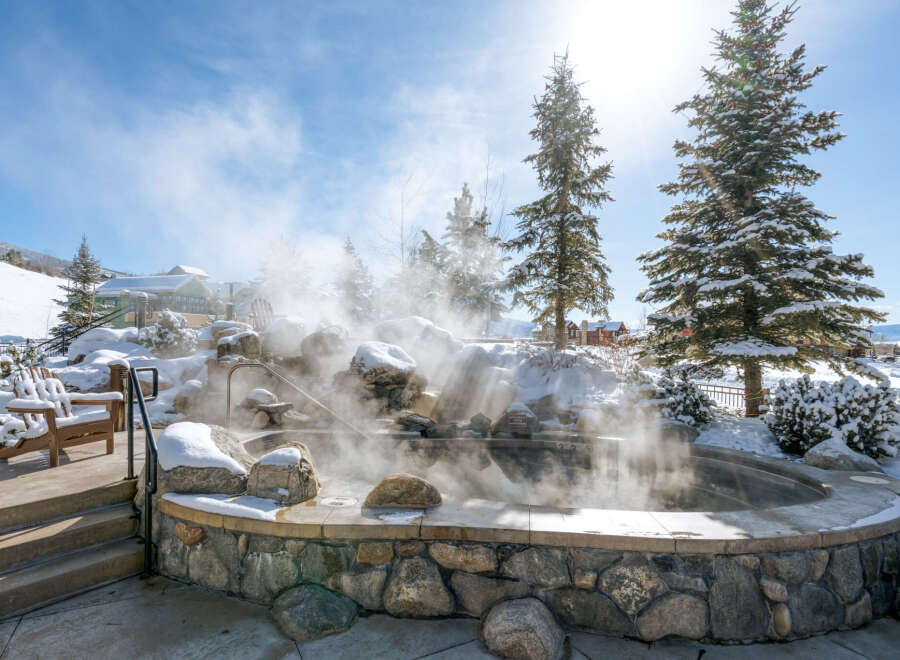 Experience ultimate relaxation in this luxurious outdoor hot tub, perfect for unwinding after a day on the slopes.