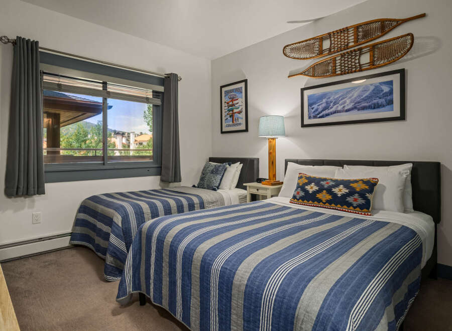 This charming bedroom features two comfortable twin beds, perfect for accommodating guests or family.