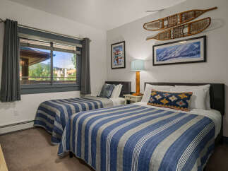 This charming bedroom features two comfortable twin beds, perfect for accommodating guests or family.