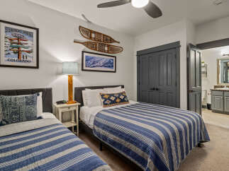 This charming bedroom features two comfortable twin beds, perfect for accommodating guests or family.
