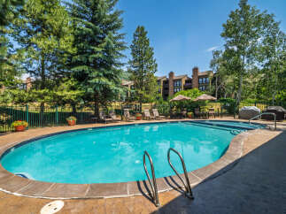 Enjoy a refreshing dip in this stunning outdoor swimming pool, perfect for relaxation and fun.