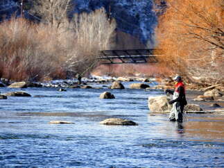 Experience the tranquility of fly fishing in this picturesque riverfront property.