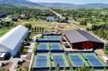 Experience world-class tennis at this expansive facility featuring numerous outdoor courts and a large indoor arena for year-round play.