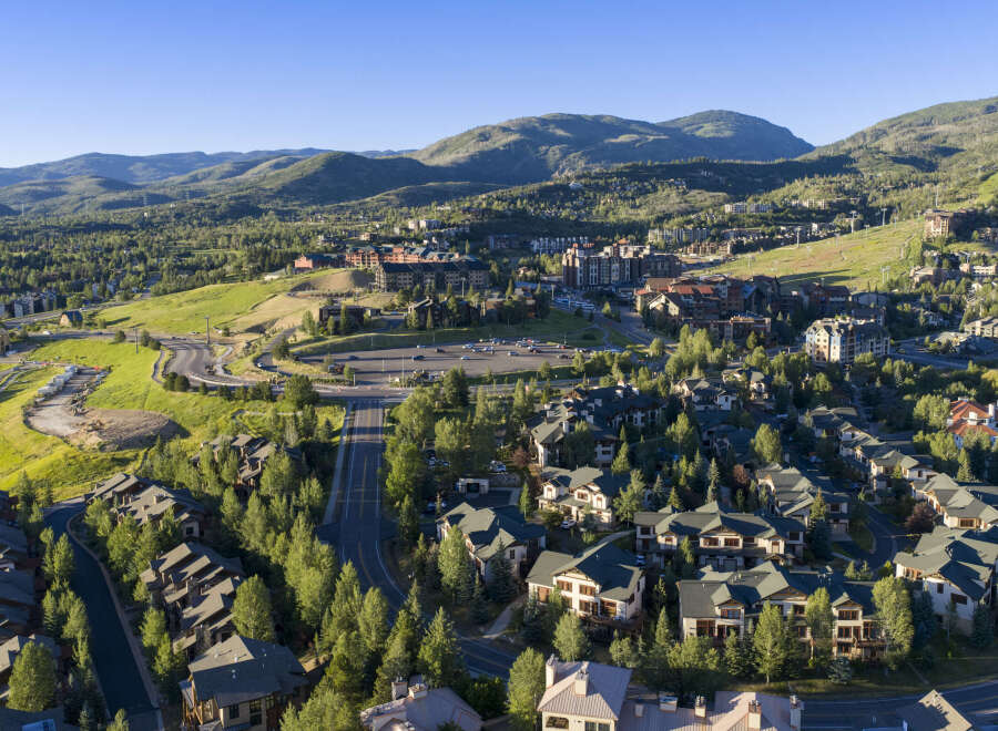 Discover this stunning mountain resort community, featuring a collection of luxurious homes nestled amidst lush green hills and mature trees.