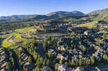 Discover this stunning mountain resort community, featuring a collection of luxurious homes nestled amidst lush green hills and mature trees.