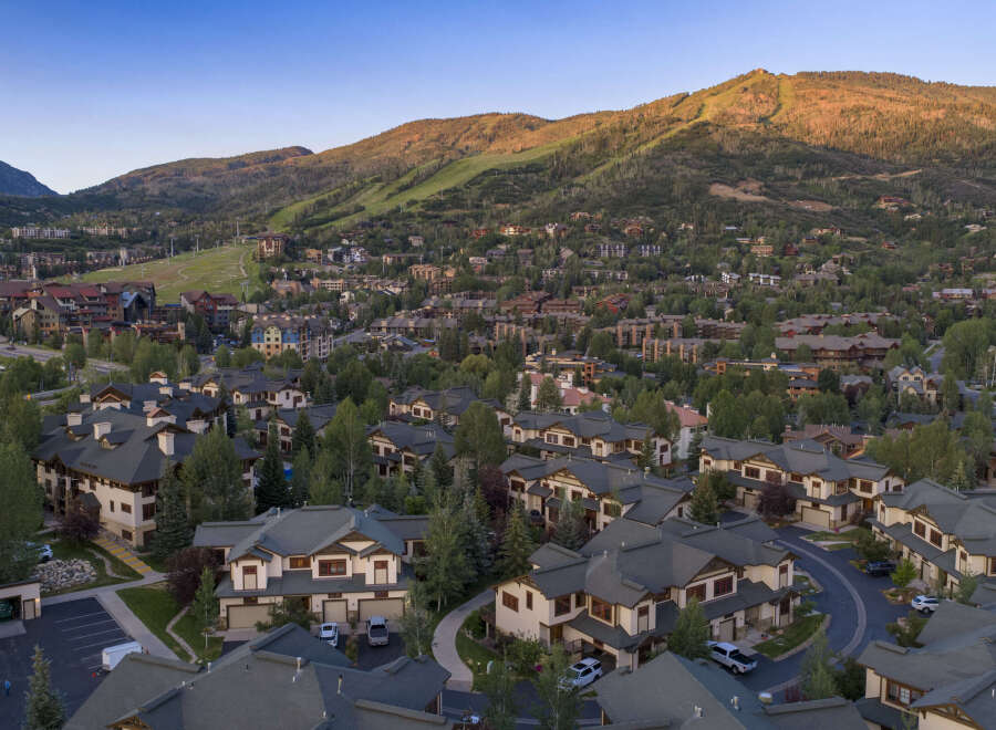 Experience luxury mountain living in this stunning property, nestled amidst the scenic beauty of a ski resort town.