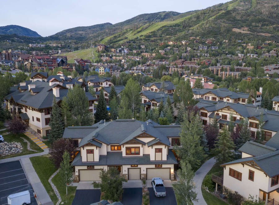 Experience luxury mountain living in this stunning property, featuring a modern architectural design with warm, natural materials.