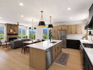 Experience modern living in this open-concept home featuring a stunning stone fireplace and expansive windows with breathtaking mountain views.