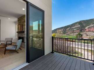 Experience seamless indoor-outdoor living with this stunning property, featuring a modern living space that opens onto a private balcony.