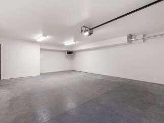 Discover this spacious and clean garage, perfect for your vehicles and storage needs.
