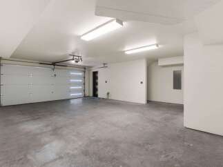 This spacious garage offers ample room for multiple vehicles and storage.