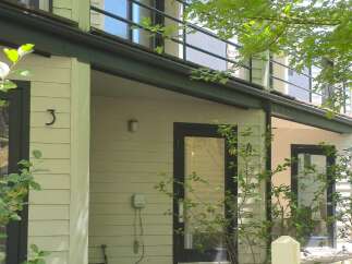 Discover this charming property featuring a welcoming facade with a prominent number '3' and a second unit marked with '4'.