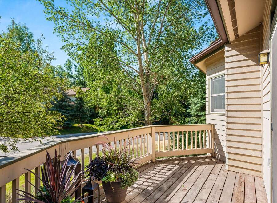 Enjoy the outdoors from this charming deck, perfect for morning coffee or evening relaxation.