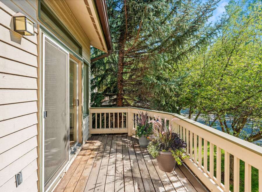 Enjoy the outdoors from this charming deck, perfect for morning coffee or evening relaxation.