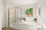 Indulge in relaxation in this luxurious bathroom featuring a spacious corner bathtub with elegant gold fixtures.