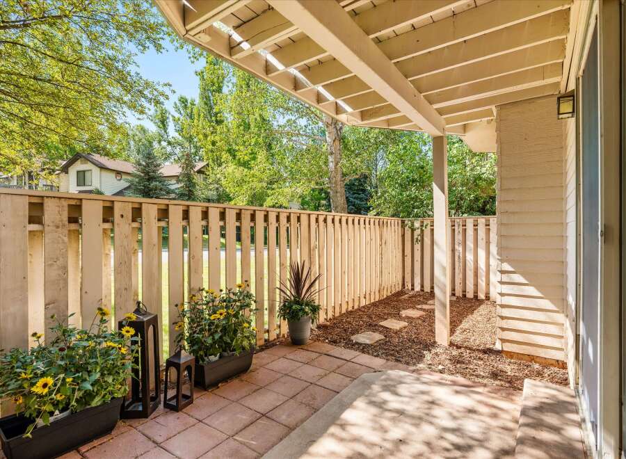 Enjoy outdoor living on this charming patio, perfect for relaxing or entertaining.