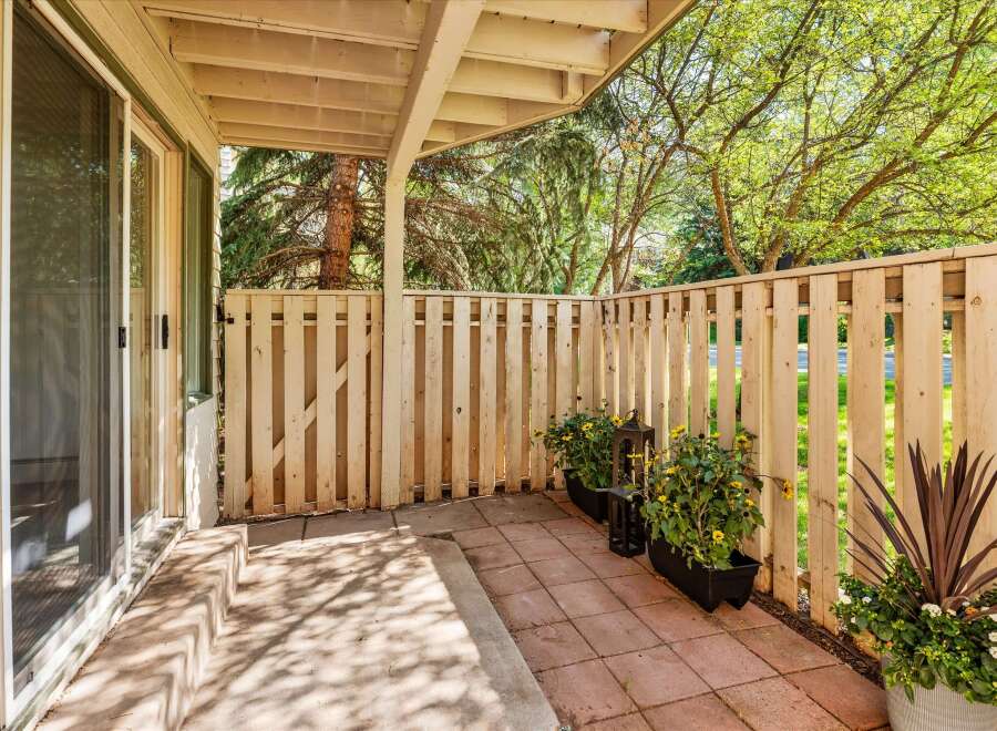 Enjoy outdoor living on this charming patio, perfect for relaxing or entertaining.