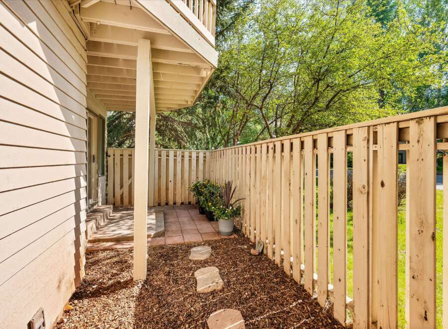 Enjoy private outdoor living in this charming patio area, perfect for relaxing or entertaining.