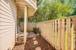 Enjoy private outdoor living in this charming patio area, perfect for relaxing or entertaining.