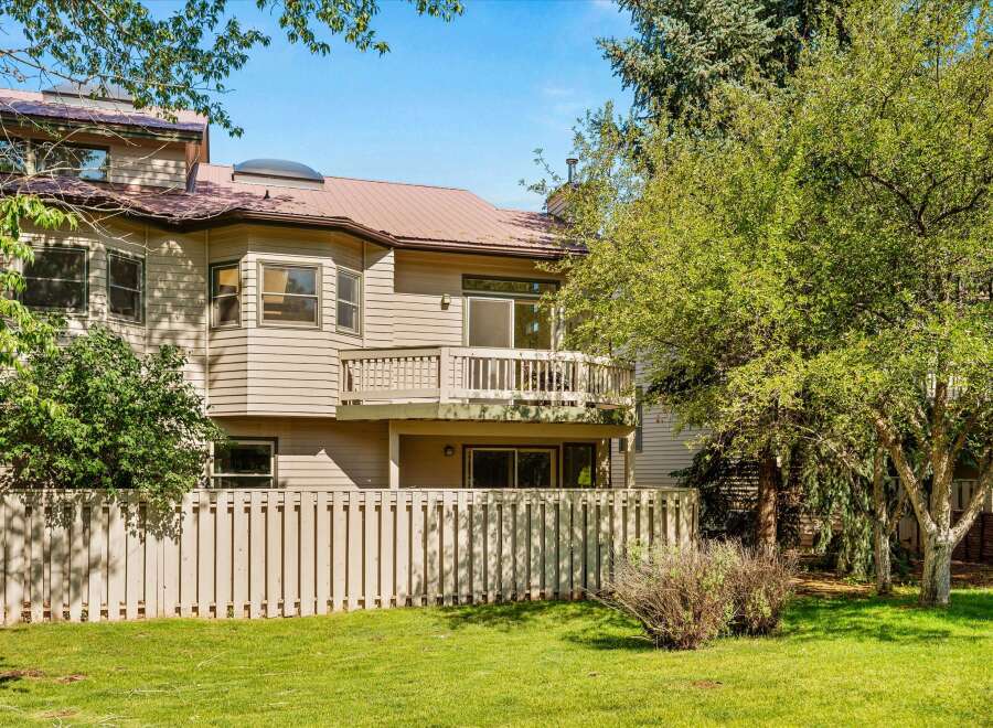 This charming property features a multi-level design with a prominent balcony offering outdoor living space.