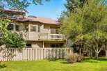 This charming property features a multi-level design with a prominent balcony offering outdoor living space.