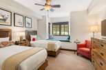 Experience comfort and style in this inviting hotel room featuring two twin beds, perfect for families or friends traveling together.