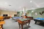 This spacious game room offers endless entertainment with a variety of classic games.